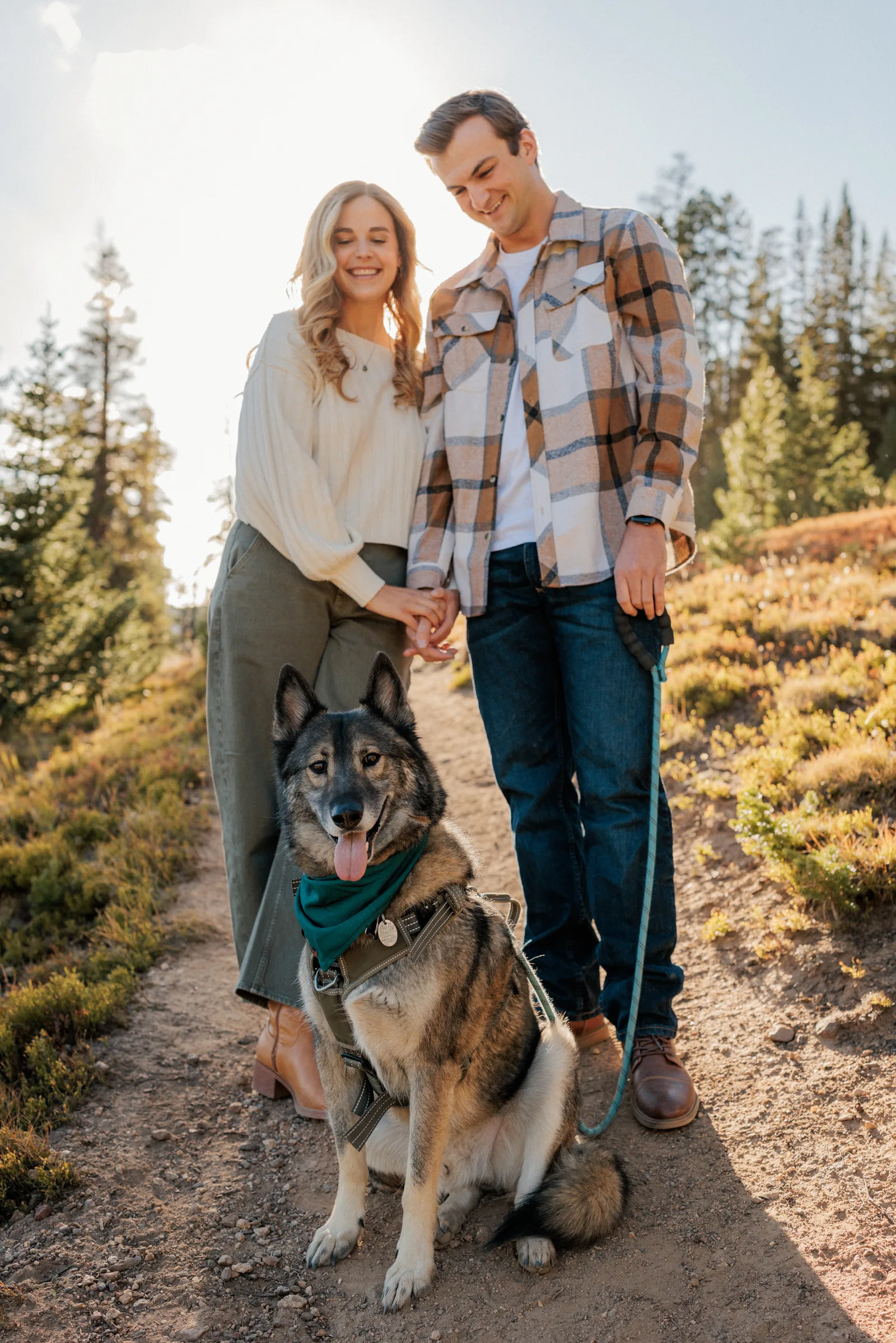 Jordan and Daelynn on a mountain trail with their dog, Churchill